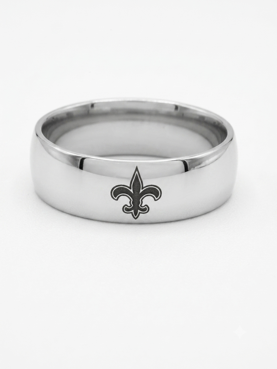 A silver-toned metal band ring featuring a black fleur-de-lis logo on the front, photographed against a clean white background.